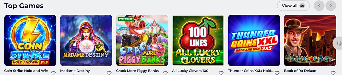 A Top Games carousel showing popular slots like Coin Strike, Madame Destiny, Crack More Piggy Banks, All Lucky Clovers 100, Thunder Coins XXL, and Book of Ra Deluxe, with a “View all” button.